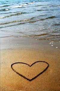 Heart drawn in beach sand
